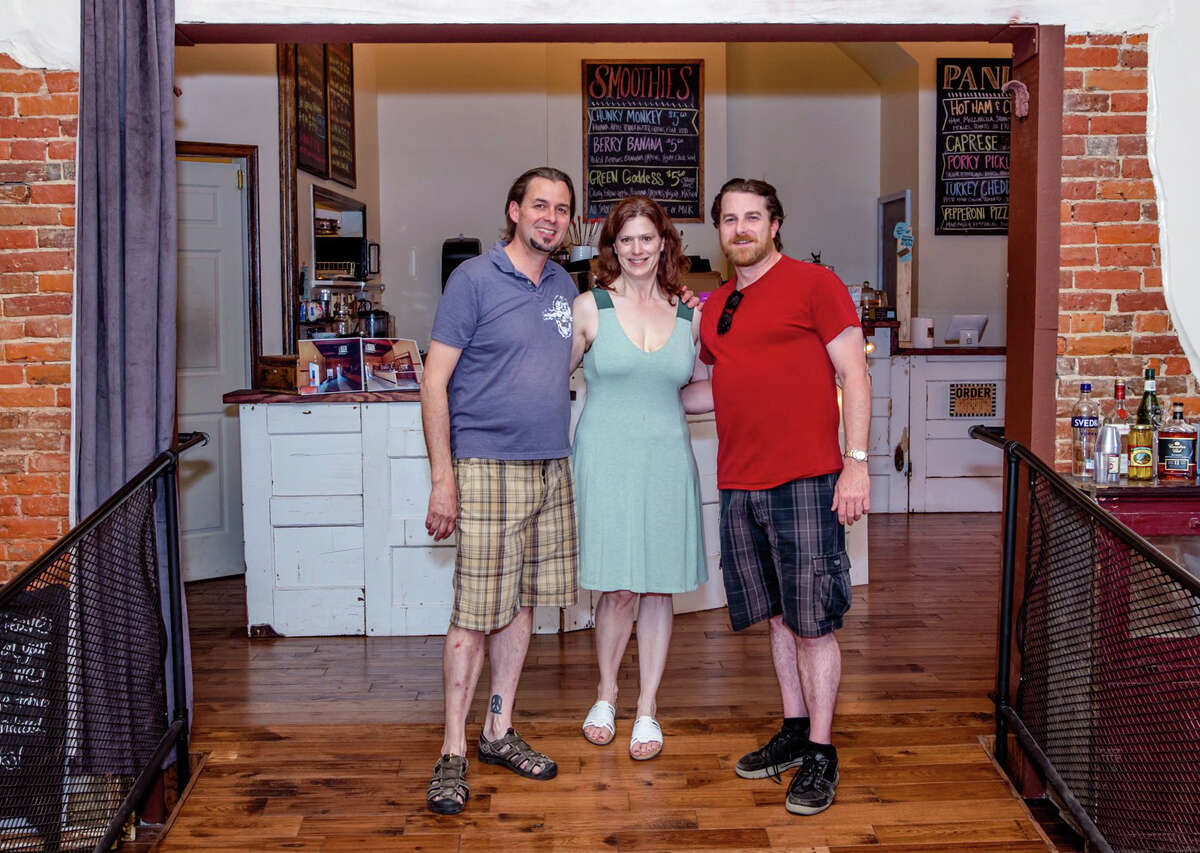 Erik Hack (from left), Jennifer Hack and Jeremy Coumbes rehabilitated this building at 207-209 S. Sandy St.
