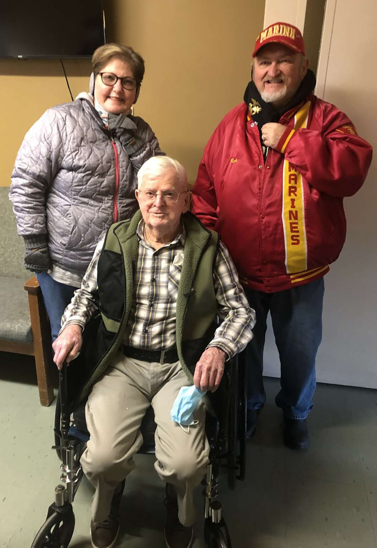 Jerry Lowe (seated) recently celebrated his 96th birthday with a  visit from Marine Corps League members Earlita and Rick Howland.