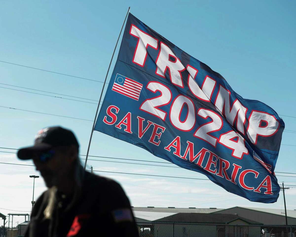 A pro-Trump flag flies near the location of Saturday’s Save America rally where former President Donald Trump will speak, Wednesday, Jan. 26, 2022, in Conroe.