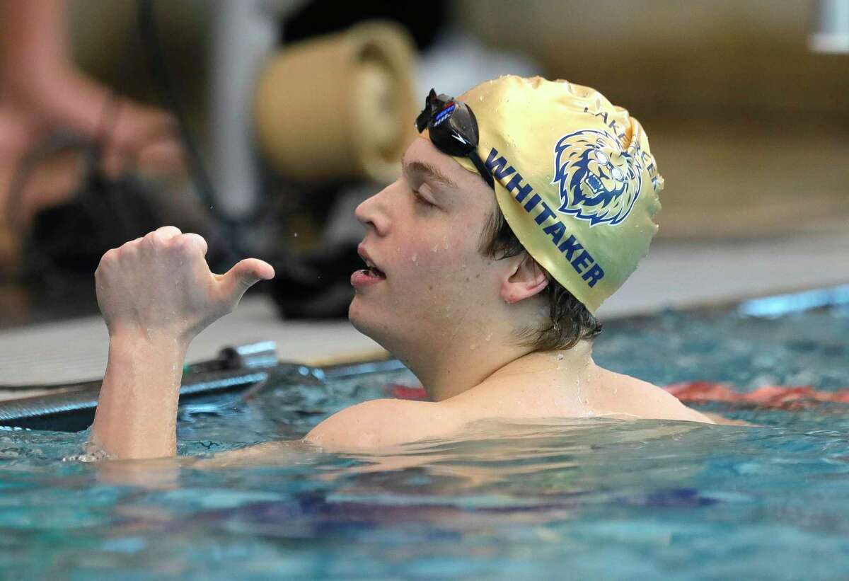Lake Creek’s Jacob Whitaker gives a thumbs-up after competing in the boys 100-yard butterfly during the District 21-5A Swimming & Diving Championships at the New Caney Natatorium, Friday, Jan. 28, 2022, in New Caney.
