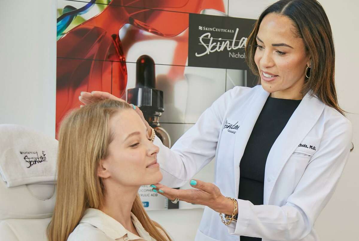 Dr. Kim Nichols with a patient at SkinLab in Stamford, Conn.