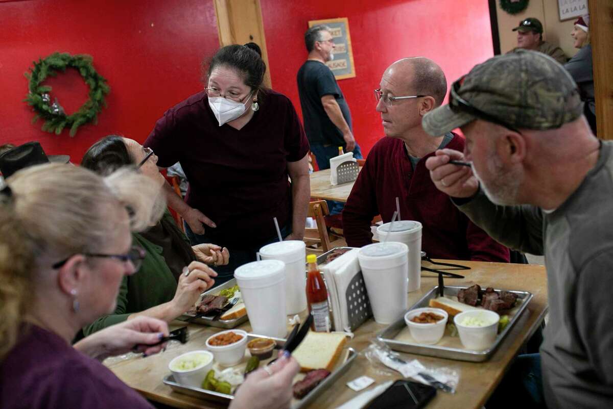 Jenna Sawers excitedly talks with family members who came to support Two Sawers BBQ on its last day of business in Floresville on Jan. 22.