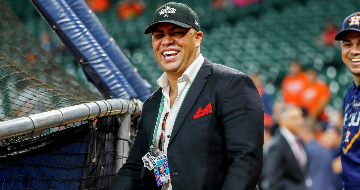 Former Astros player Carlos Beltran laughs as he visits Astros batting practice before Game 2 of the American League Championship Series at Minute Maid Park on Sunday, Oct. 13, 2019, in Houston.