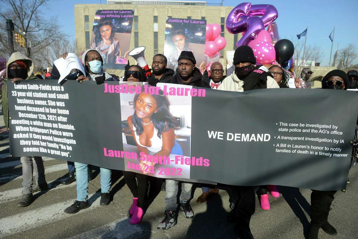 Family and friends of Lauren Smith-Fields gathered for a protest march in her memory in Bridgeport, Conn. Jan. 23, 2022. Smith-Fields was found dead in her Bridgeport apartment in December and her family and friends marched in her memory on Sunday, which would have been her 24th birthday. The death of the Black women has her family and the community asking questions about policing, race and victims rights. (Ned Gerard/Hearst Connecticut Media via AP)