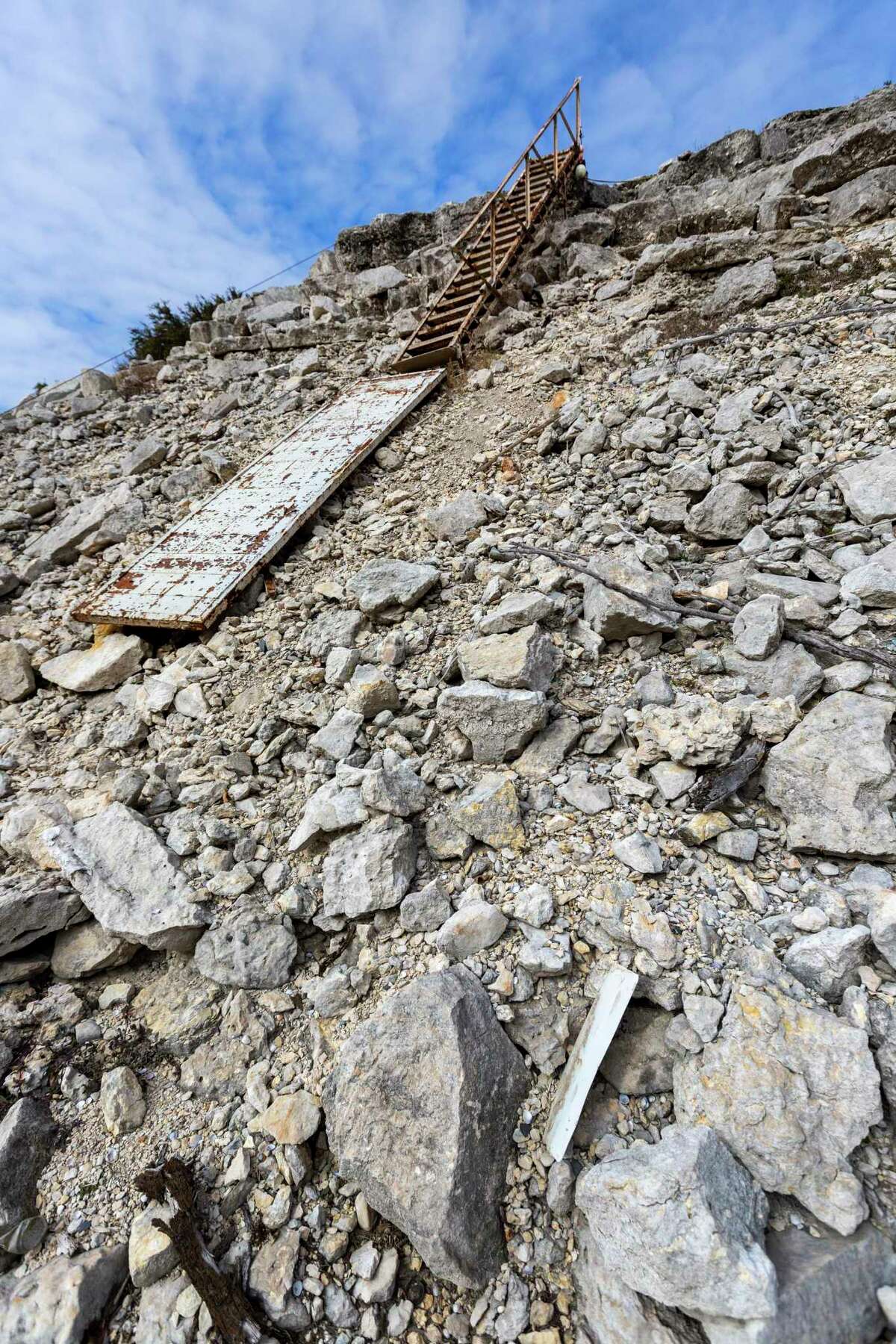 Steps that normally lead to a floating dock sit far from the water in the Pebble Beach area of Medina Lake on Jan. 21.
