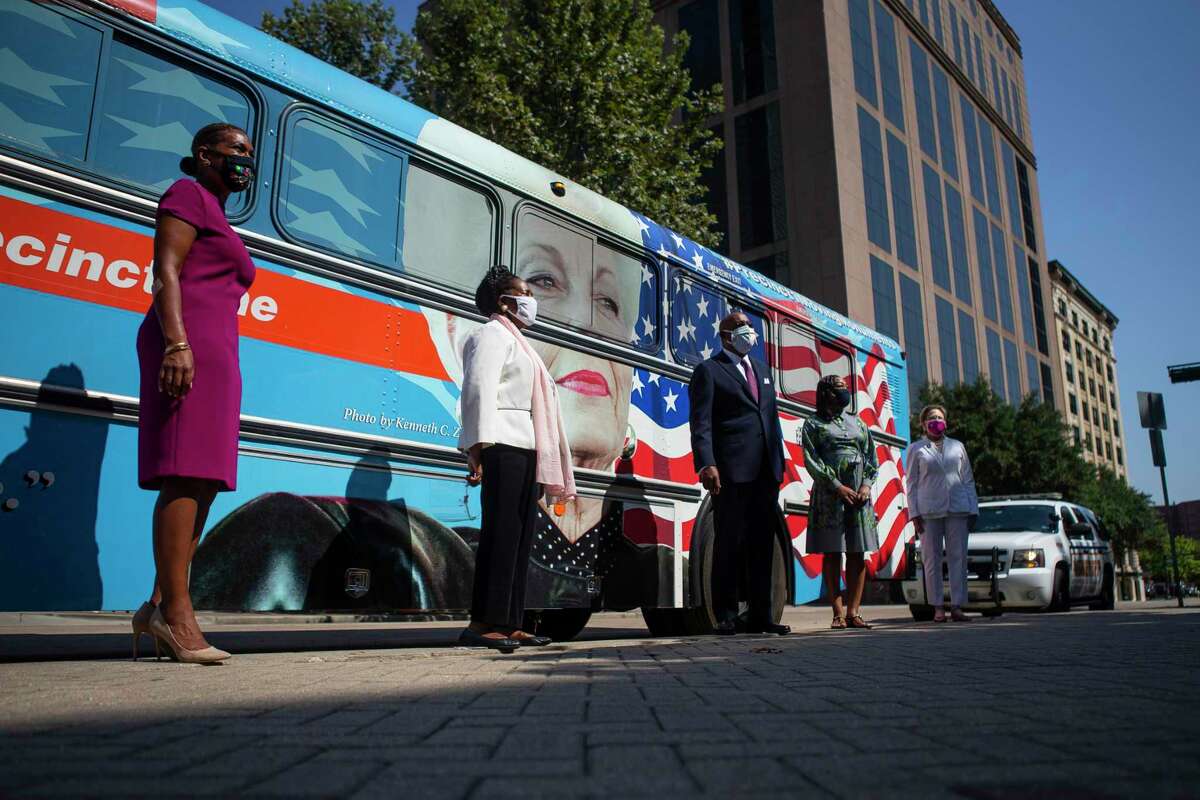 City Council Member Letitia Plummer (left), U.S. Rep. Sheila Jackson Lee, Harris County Commissioner Rodney Ellis, League of Women Voters Board Member Michelle Levi McDaniel and President & CEO of Planned Parenthood Gulf Coast Melaney Linton pose for photos in front of the Ann Richards moving monument bus outside of a press conference honoring the 100th anniversary of the 19th Amendment, Tuesday, Aug. 18, 2020, at the 1910 Harris County Courthouse in downtown Houston.