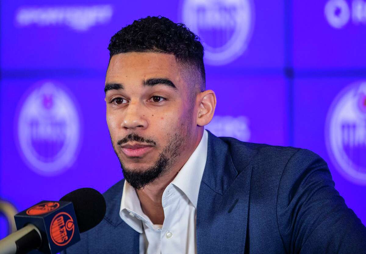 Evander Kane speaks at a press conference in Edmonton, Alberta, after being introduced as the newest player on the Oilers. Kane is expected to make his Oilers debut Saturday.