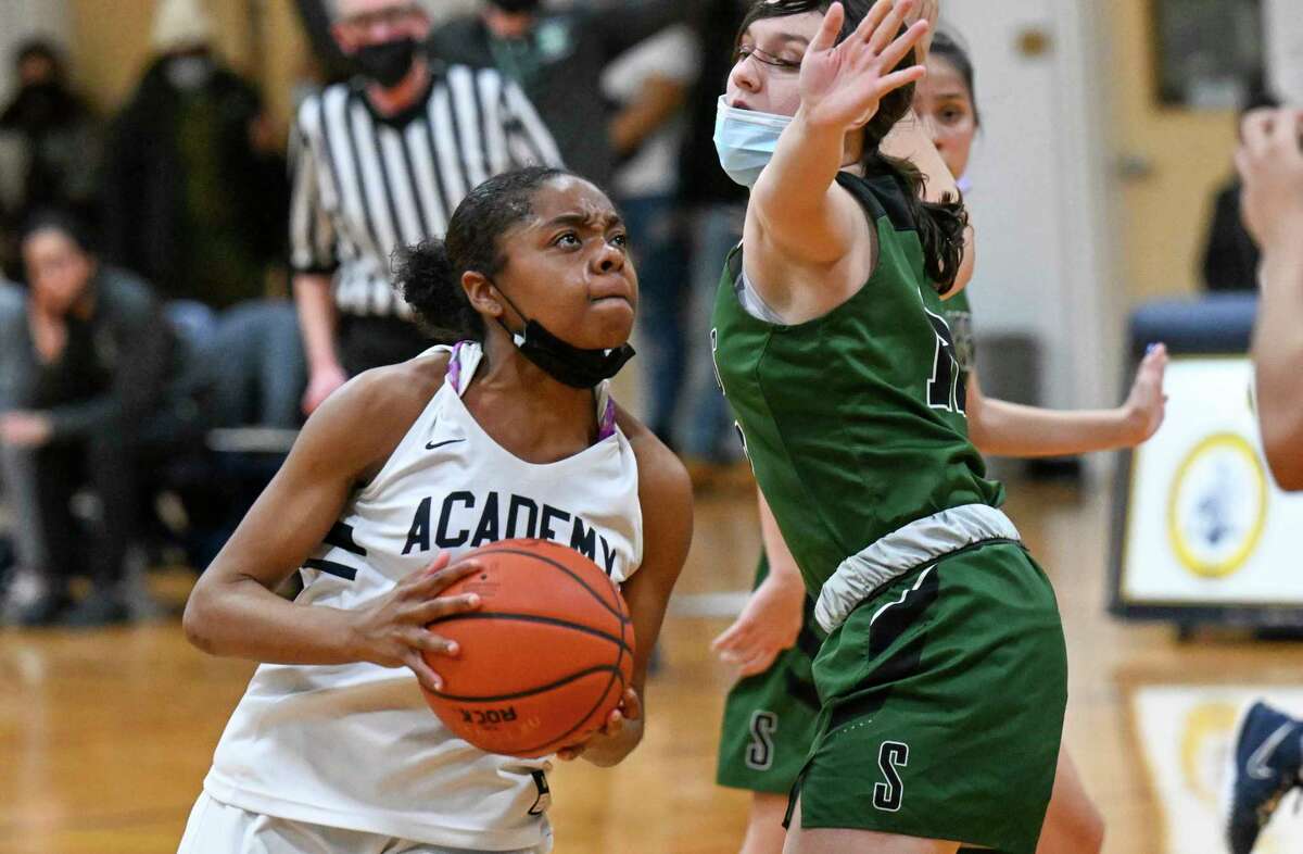 Albany Academy’s Saige Randolph, left, moves the ball against Schalmont’s Sara Kindlon during a girls’ high school basketball game Friday, Jan. 28, 2022, in Albany, N.Y.