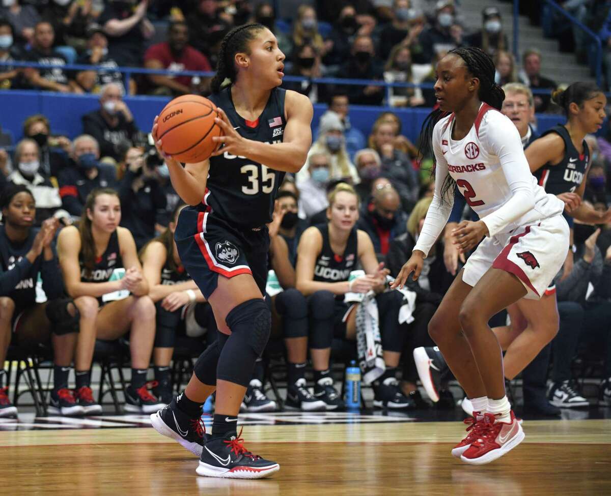 UConn’s Azzi Fudd, left, plays in UConn’s season-opening 95-80 win over Arkansas in at the XL Center in Hartford on Nov. 14.