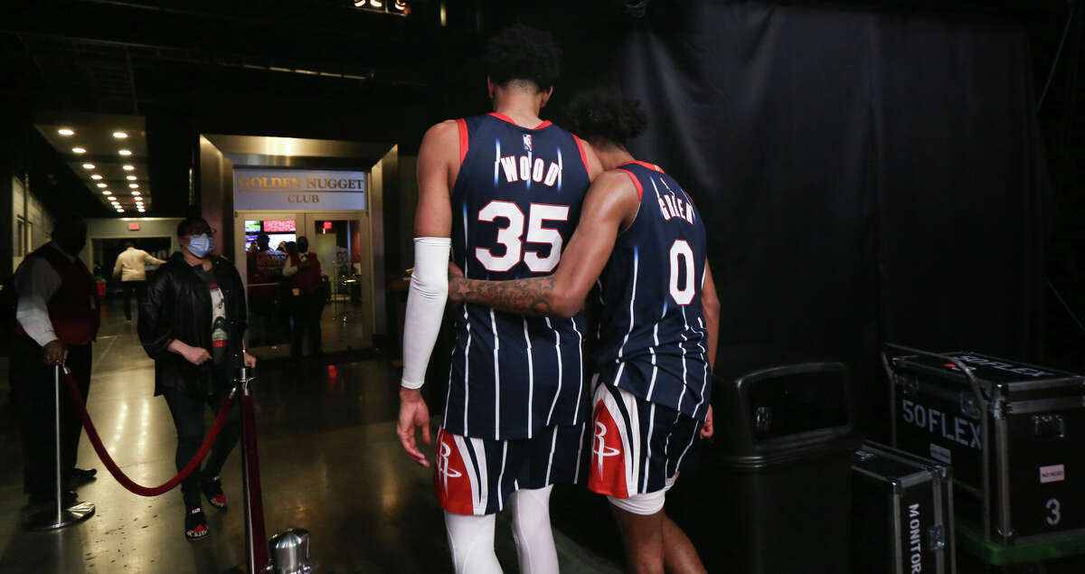 Houston Rockets center Christian Wood (35) and guard Jalen Green (0) hug as they walk to the locker room after the Houston Rockets lost to the Portland Trail Blazers on Friday, Jan. 28, 2022, at the Toyota Center in Houston.