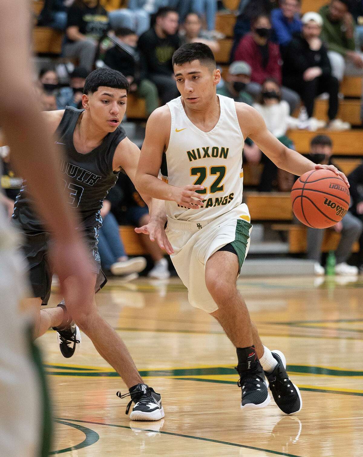 Nixon High School’s Adrien Medellin moves the ball down the court during a game against United South High School. Medellin finished with 23 points in the Mustang’s win over LBJ on Wednesday. Twelve of his points came from the free-throw line.