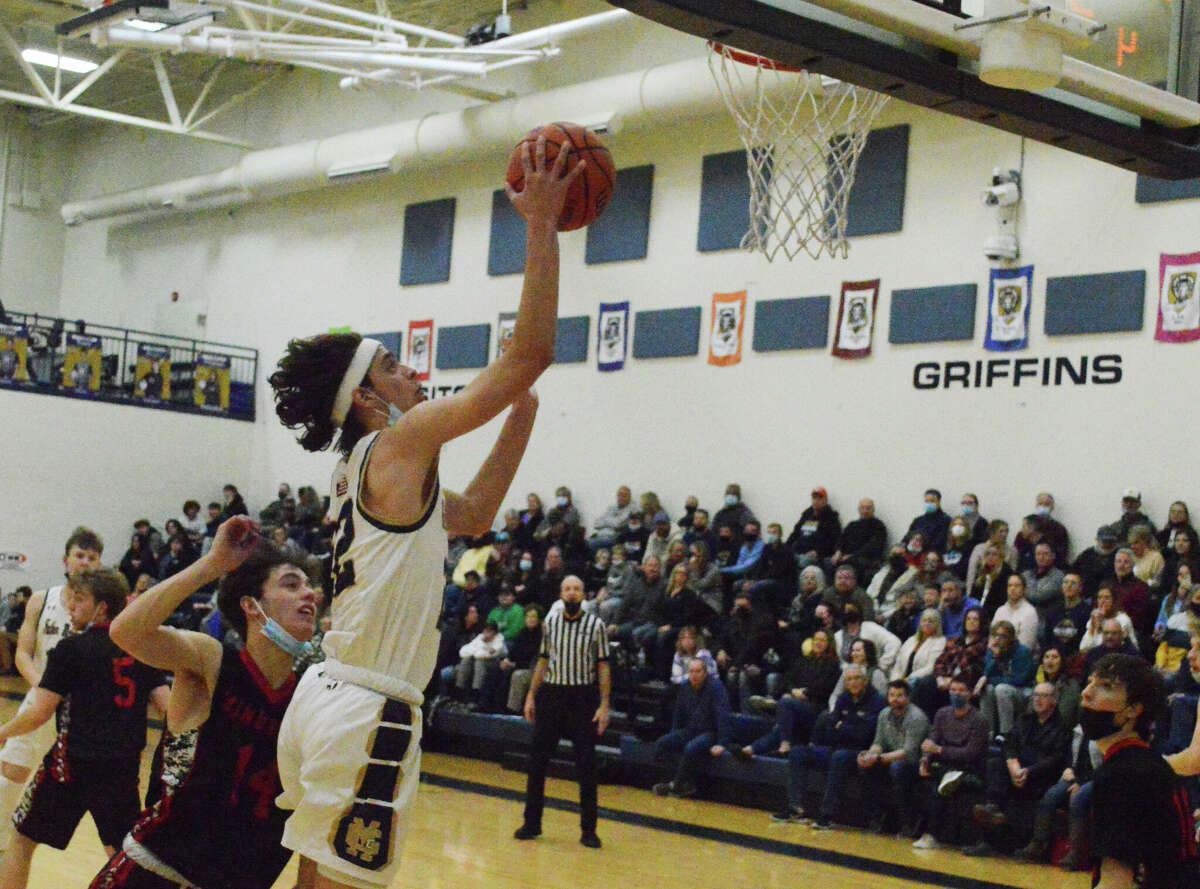 Darren Luchetti finishes a layup against Bunker Hill. In the 60-46 win on Friday, Luchetti scored 14 points for the Griffins. 