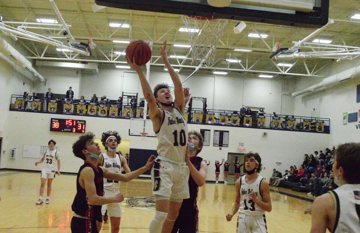 Jackson Rodgers (10) finishes a layup against Bunker Hill. In the 60-46 win on Friday, Rodgers scored a team-high 18 points for the Griffins.