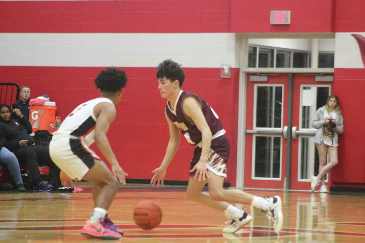 Deer Park's Andrew Aguilar excelled at the point guard position again. He made the Trojans pay at the foul line, sinking 5-of-6 in the second half during the team's sorely-needed 40-25 district win.