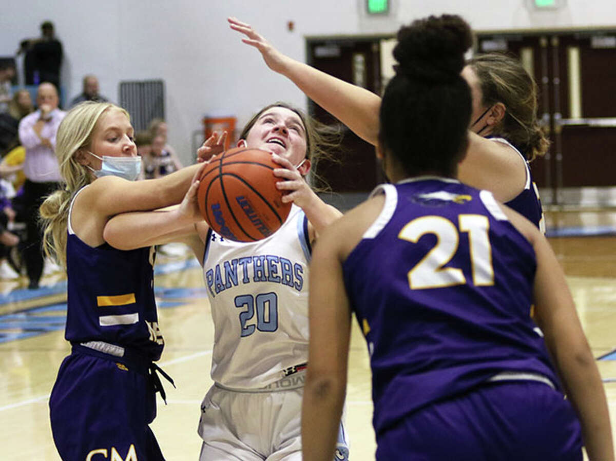 Jersey's Elise Noble (20) tries to put up a shot in traffic during a MVC game against CM earlier this season in Jerseyville. Noble scored seven points Friday night in the Panthers' loss to Gateway Legacy at the Carrollton Tourney.