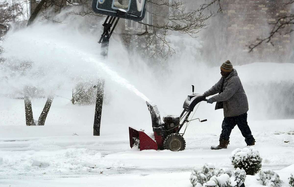 Clive Young clears his driveway on Valley Road in Fairfield on January 29, 2022.