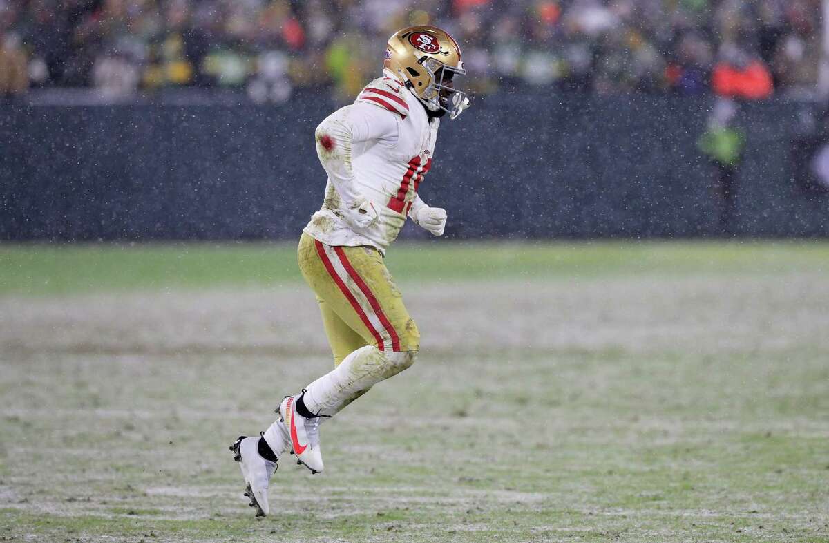 Deebo Samuel (19) limps off the field after earning a first down on a nine-yard run in the final seconds that set the winning field goal as the San Francisco 49ers took on the Green Bay Packers in the game NFL Divisional Round Playoff. at Lambeau Field in Green Bay, Wisconsin on Saturday, January 22, 2022.