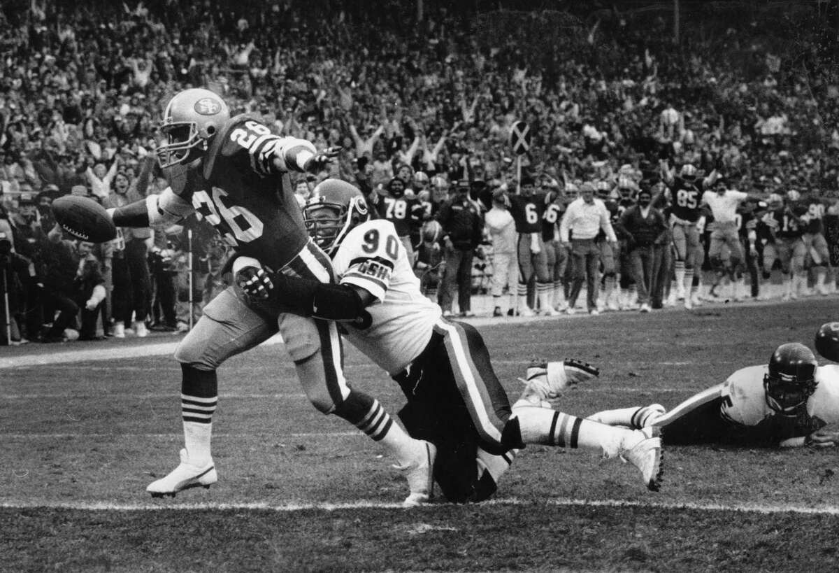 San Francisco 49ersWendell Tyler drags a defender into the end zone as the 49ers beat the Chicago Bears in the NFC Championship game, January 6, 1985