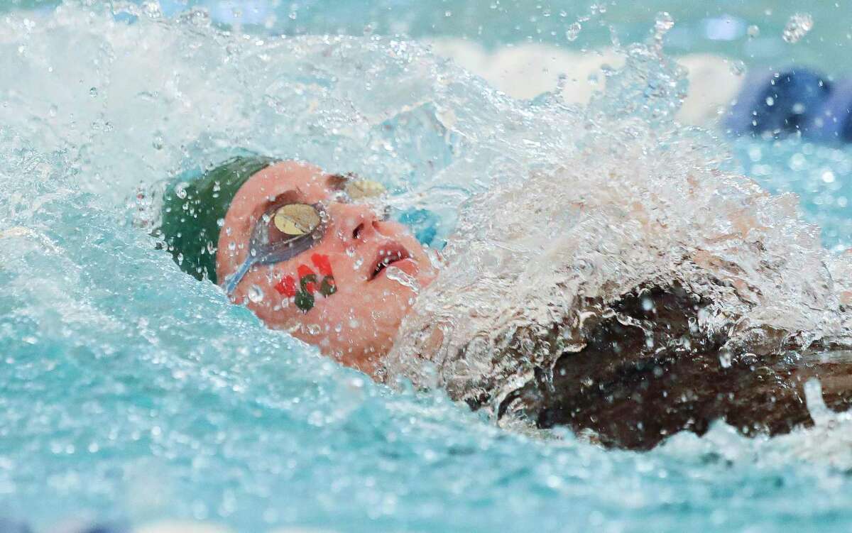 Paige Taber of The Woodlands competes in the girls 100-yard backstroke during the District 13-6A swimming and diving championship at the Conroe ISD Natatorium, Saturday, Jan. 22, 2022, in Shenandoah.