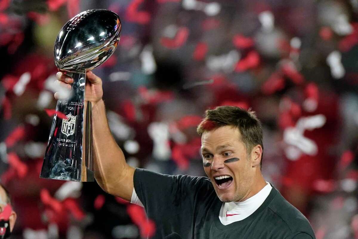 Tampa Bay Buccaneers quarterback Tom Brady celebrates with the Vince Lombardi Trophy after their NFL Super Bowl 55 football game against the Kansas City Chiefs, Sunday, Feb. 7, 2021, in Tampa, Fla. The Buccaneers defeated the Chiefs 31-9 to win the Super Bowl.