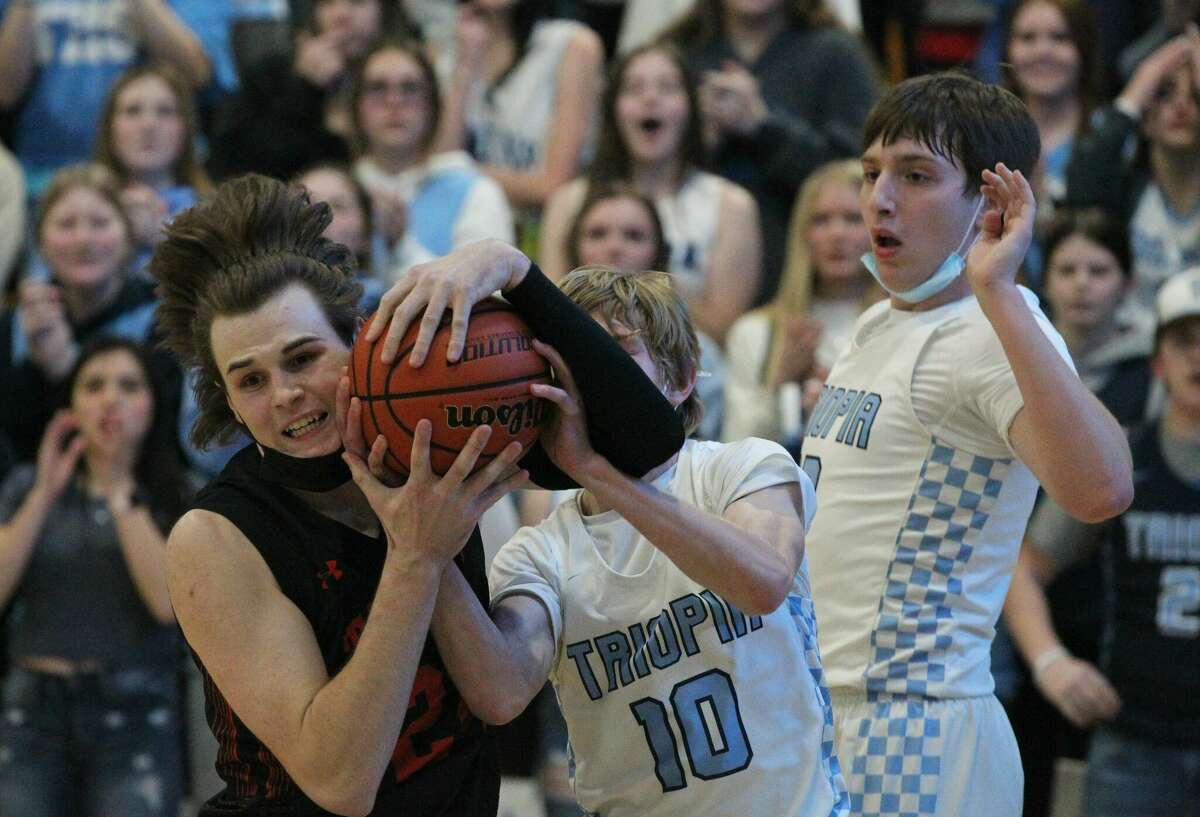 Action from the Triopia boys' basketball team's win over Beardstown Friday night at Triopia