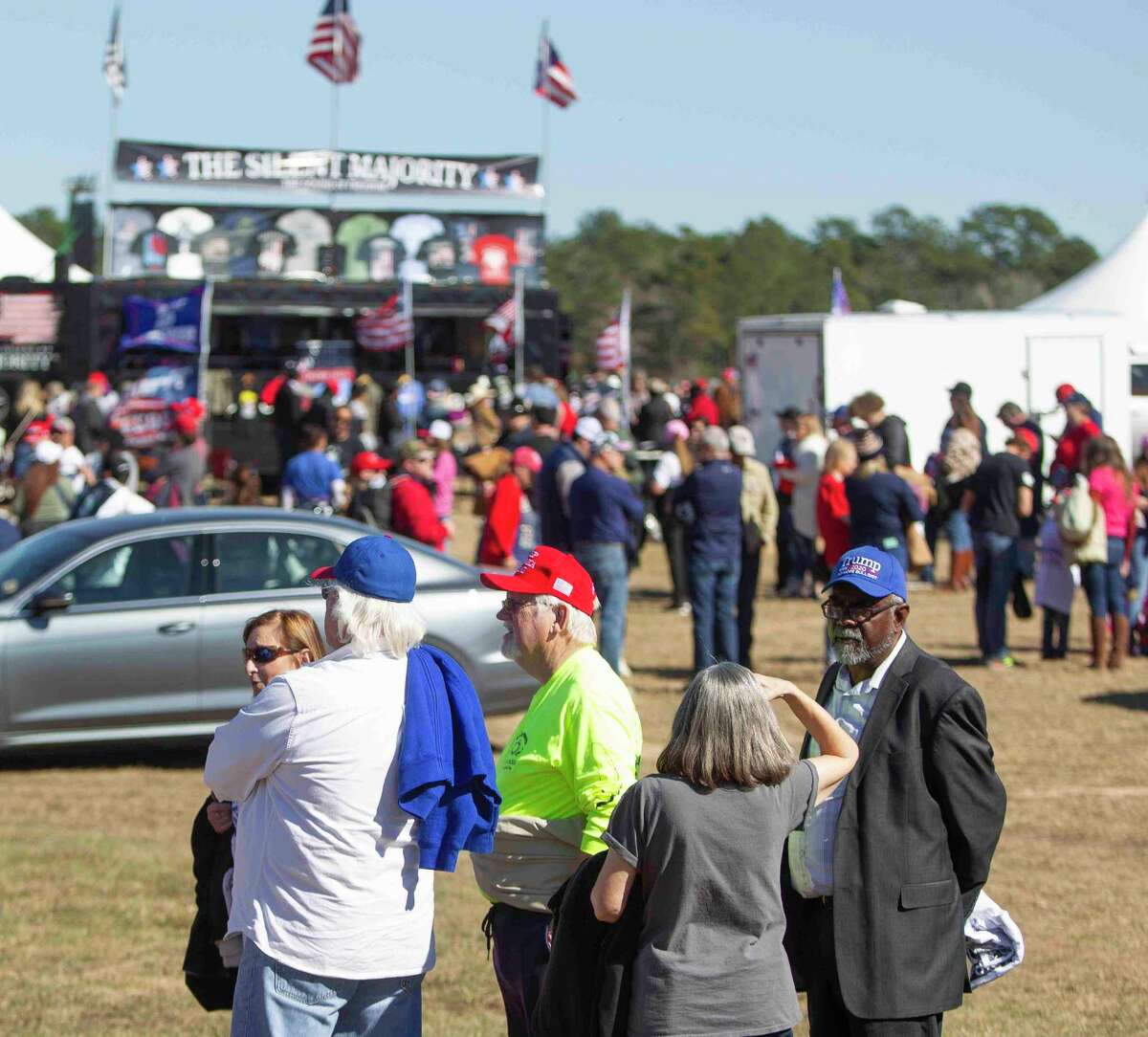 Rally goers wait in line to go through security for the Save America Rally where former President Donald Trump will speak, Saturday, Jan. 29, 2022, in Conroe.