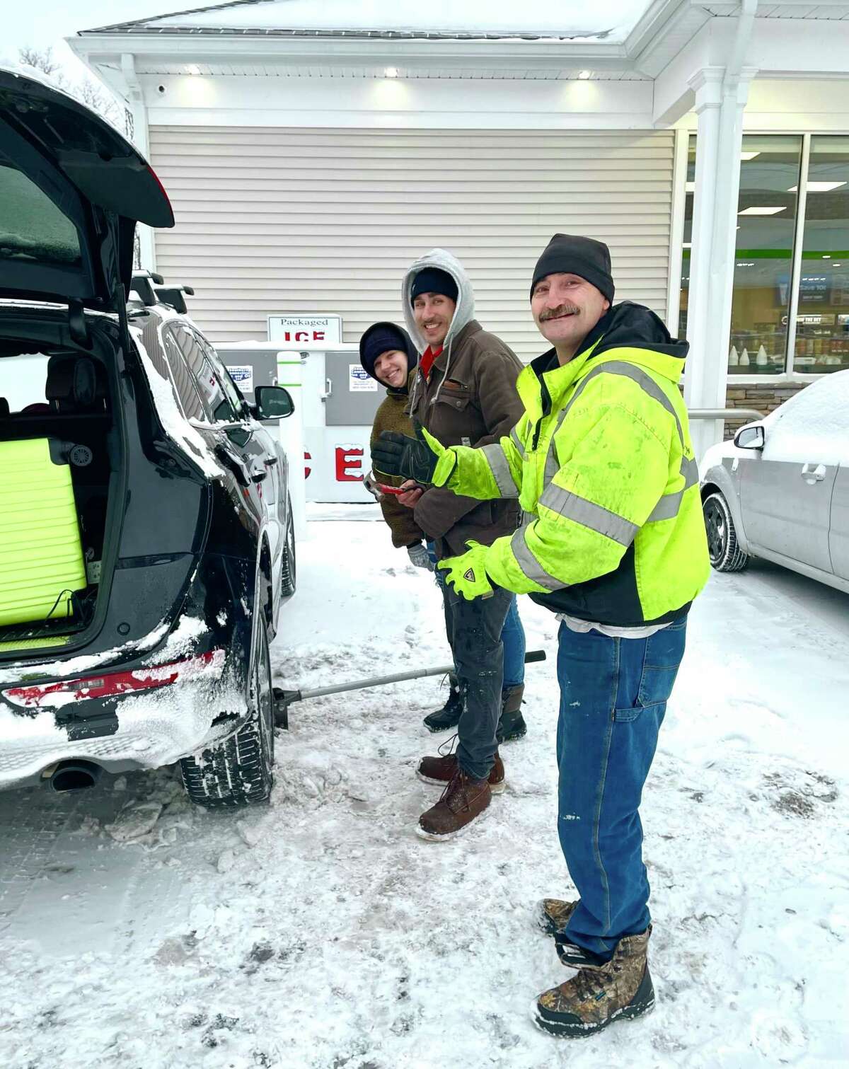 Emily and Patrick Buckland of Canton were their way to Massachusetts for the weekend with their new baby when they got a flat tire near the Cumberland Farms in Winsted. Good Samaritan, Edward Goewy of Winsted helped to fix them fix the tire.
