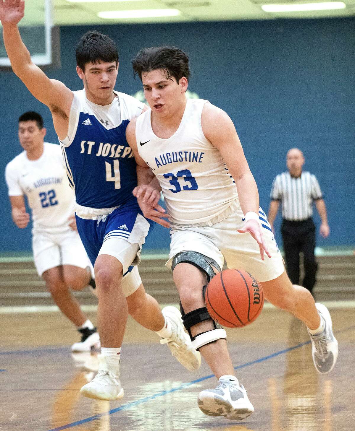 St. Augustine High School’s Esteban Barrientos moves the ball down the court during a game against St. Joseph High School Saturday, Jan. 15, 2022 at St. Augustine High School.