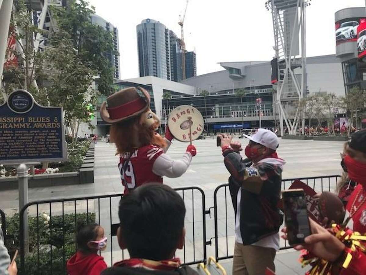 San Francisco 49ers mascot Sourdough Sam leads fans in Los Angeles’ L.A. Live entertainment district in chants of “Beat L.A.”