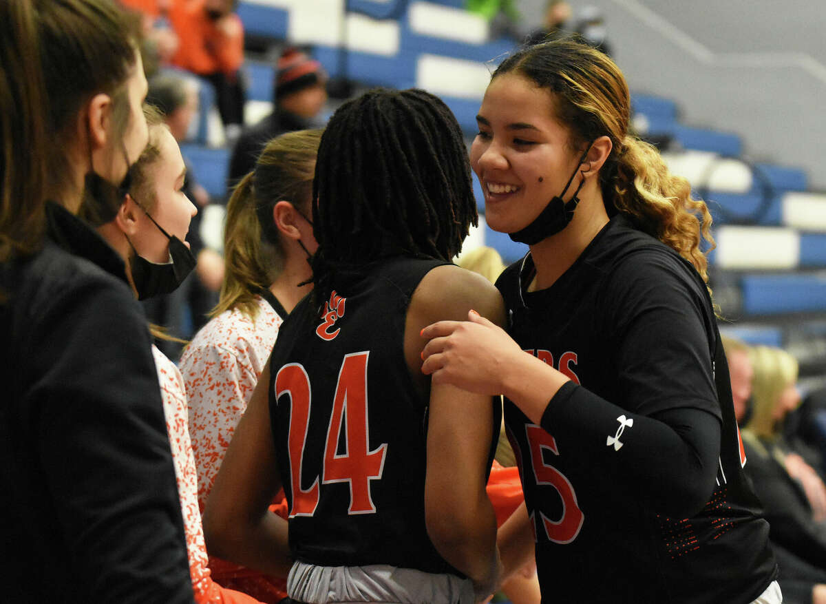 Edwardsville's Sydney Harris is congratulated by teammates after becoming the program's all-time leading scorer on Saturday against Vashon in St. Louis.