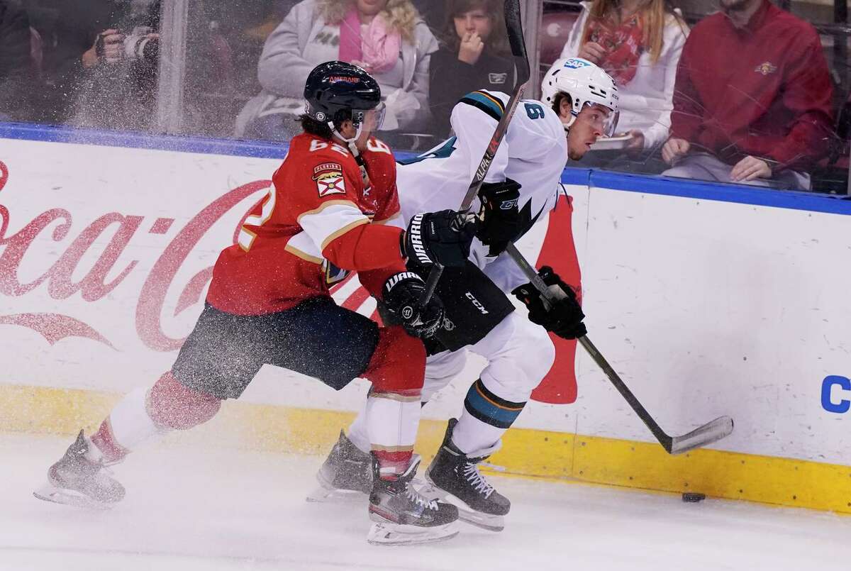 Panthers defenseman Brandon Montour (62) and Sharks center Jasper Weatherby fight for the puck. The Sharks took a 4-2 lead in the third period but the Panthers rallied to force overtime.