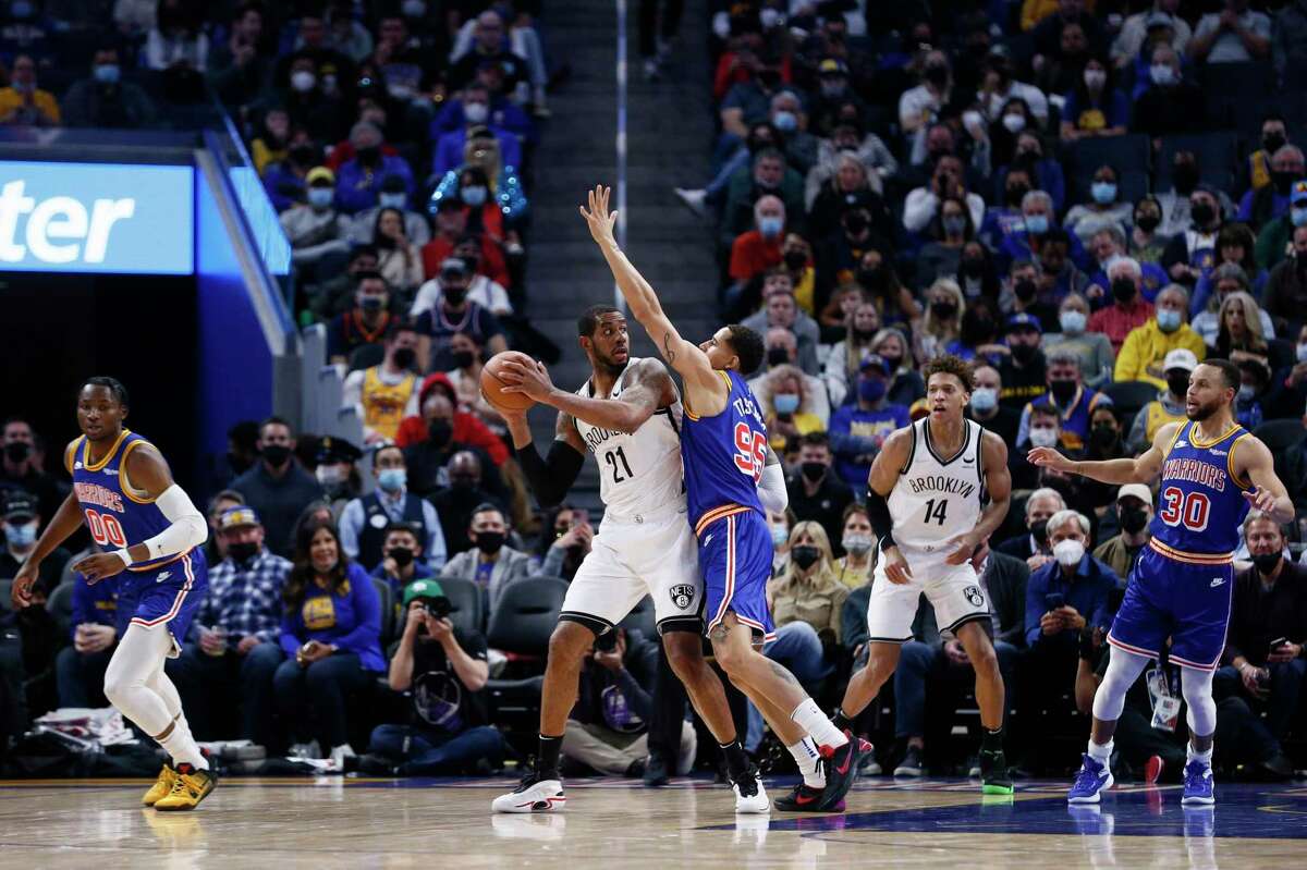 Brooklyn Nets center LaMarcus Aldridge (21) against Golden State Warriors forward Juan Toscano-Anderson (95) in the second quarter of an NBA game at Chase Center, Saturday, Jan. 29, 2022, in San Francisco, Calif.