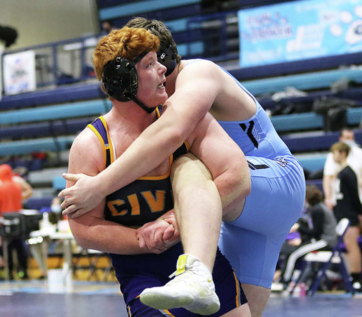 CM heavyweight Logan Cooper looks to the clock as the final seconds tick off in the third period of his match with Jersey's Jaydon Busch. Cooper scored the match-winning points as time expired and finished 5-0 Saturday at the MVC Duals at Havens Gym in Jerseyville.