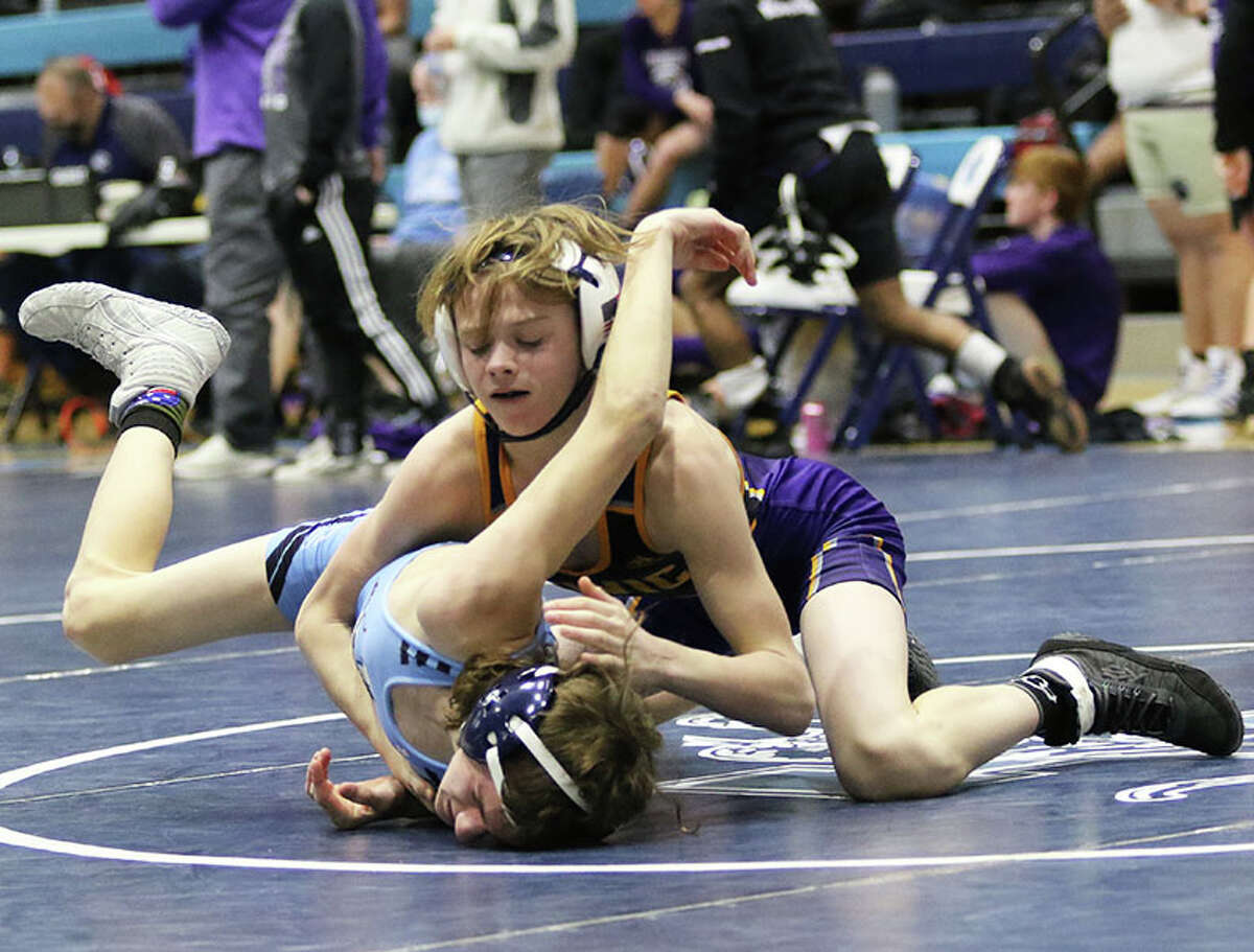 CM's Bradley Ruckman (top) tries to put his 106-pound opponent from Jersey on his back Saturday at the MVC Duals at Havens Gym in Jerseyville. Ruckman won all five of his matches at the Duals.