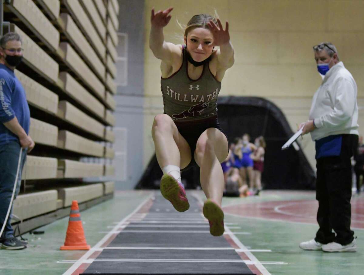 Gianna Locci of Stillwater High School sails toward the pit as she competes in the long jump at the Section II Division IV indoor track sectionals on Sunday, Jan. 30, 2022. She won the event, helping her to be named Athlete of the Week for the period of Jan. 24-30.