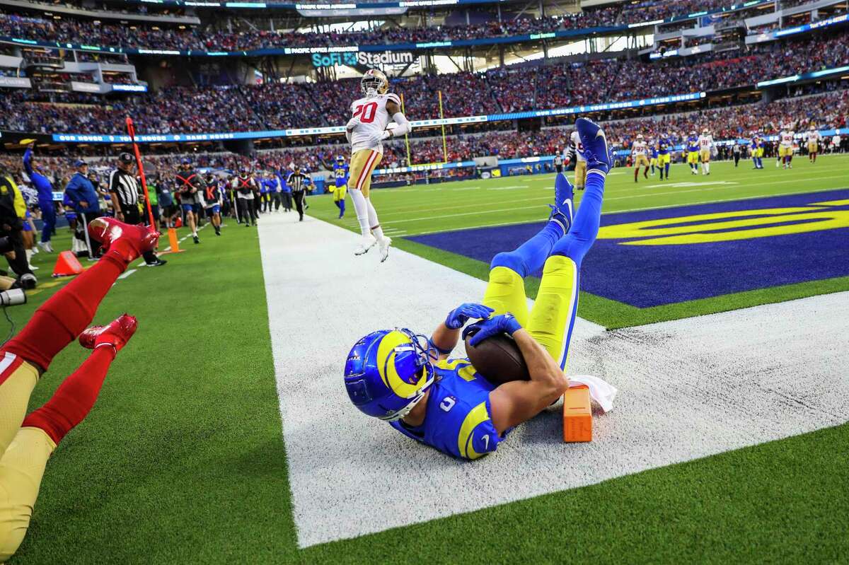 Los Angeles Rams wide receiver Cooper Kupp (10) receives a 16 yard pass from Los Angeles Rams quarterback Matthew Stafford (9) for a touchdown in the second quarter as the San Francisco 49ers play the Los Angeles Rams in the NFL NFC Championship game at SoFi Stadium in Inglewood, Calif., on Sunday, January 30, 2022.