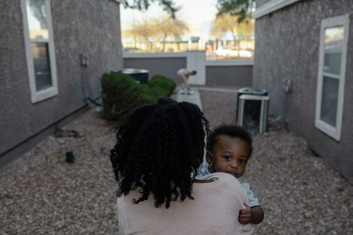 Kiara Age carries her son Kobe Jones, 1, around her apartment complex in Las Vegas. Age was notified the rent of her two bedroom apartment would increase over 20%, she now struggles to find affordable housing in Las Vegas's rental market.