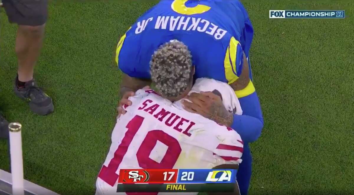 Los Angeles Rams wide receiver Odell Beckham Jr. consoles San Francisco 49ers wide receiver Deebo Samuel at the end of the NFC championship game.