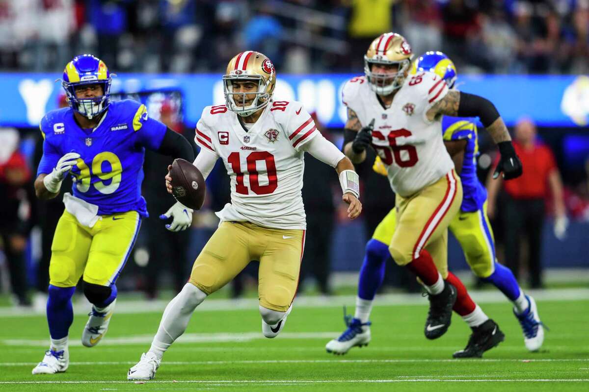 San Francisco 49ers quarterback Jimmy Garoppolo (10) scrambles in the fourth quarter as the San Francisco 49ers play the Los Angeles Rams in the NFL NFC Championship game at SoFi Stadium in Inglewood, Calif., on Sunday, January 30, 2022.