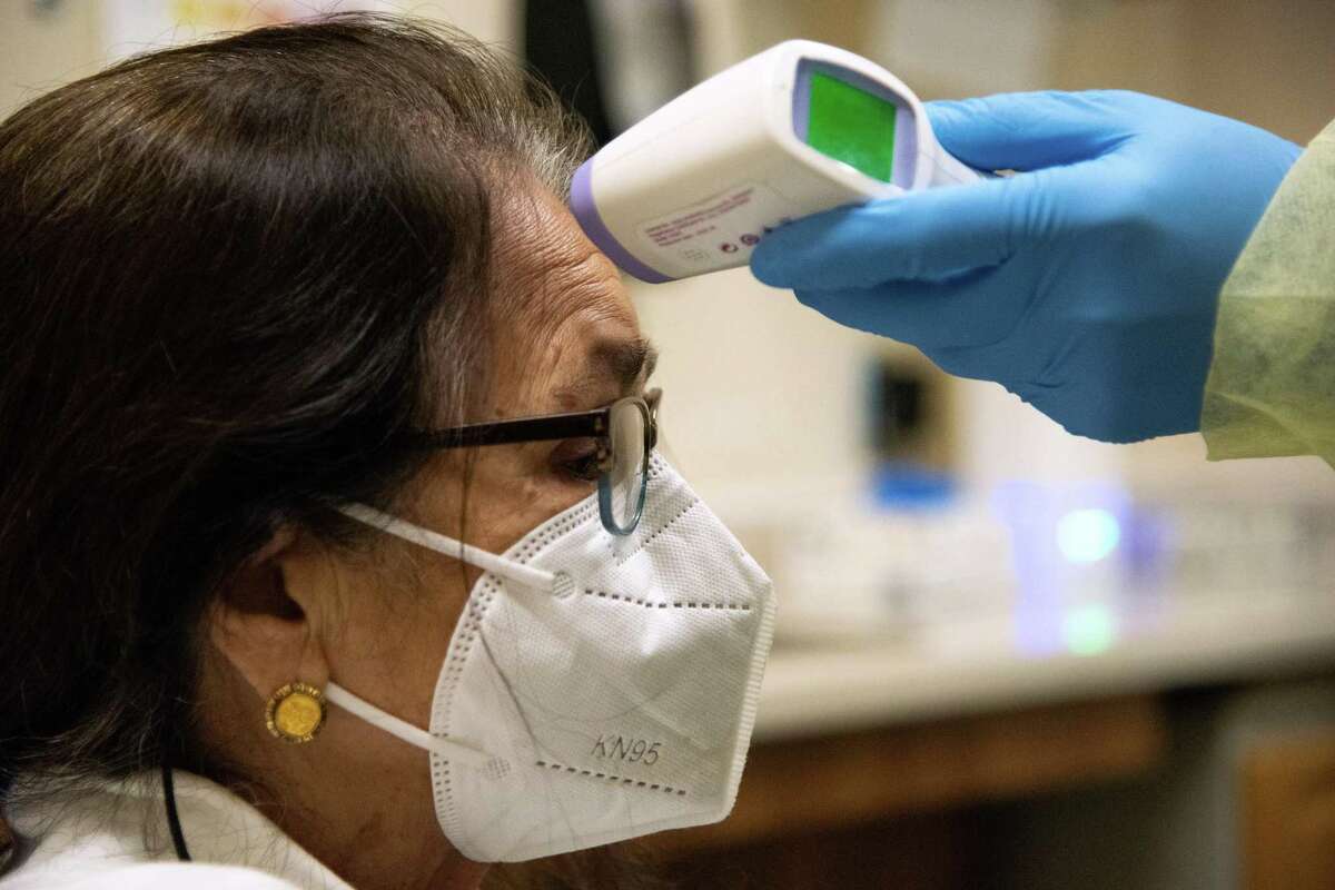 Simona Toled has her temperature checked at Petaluma Health Center after she tested positive for COVID-19. Sonoma County reported three COVID deaths for the first month of 2023, far fewer than the dozes in the prior two Januaries.
