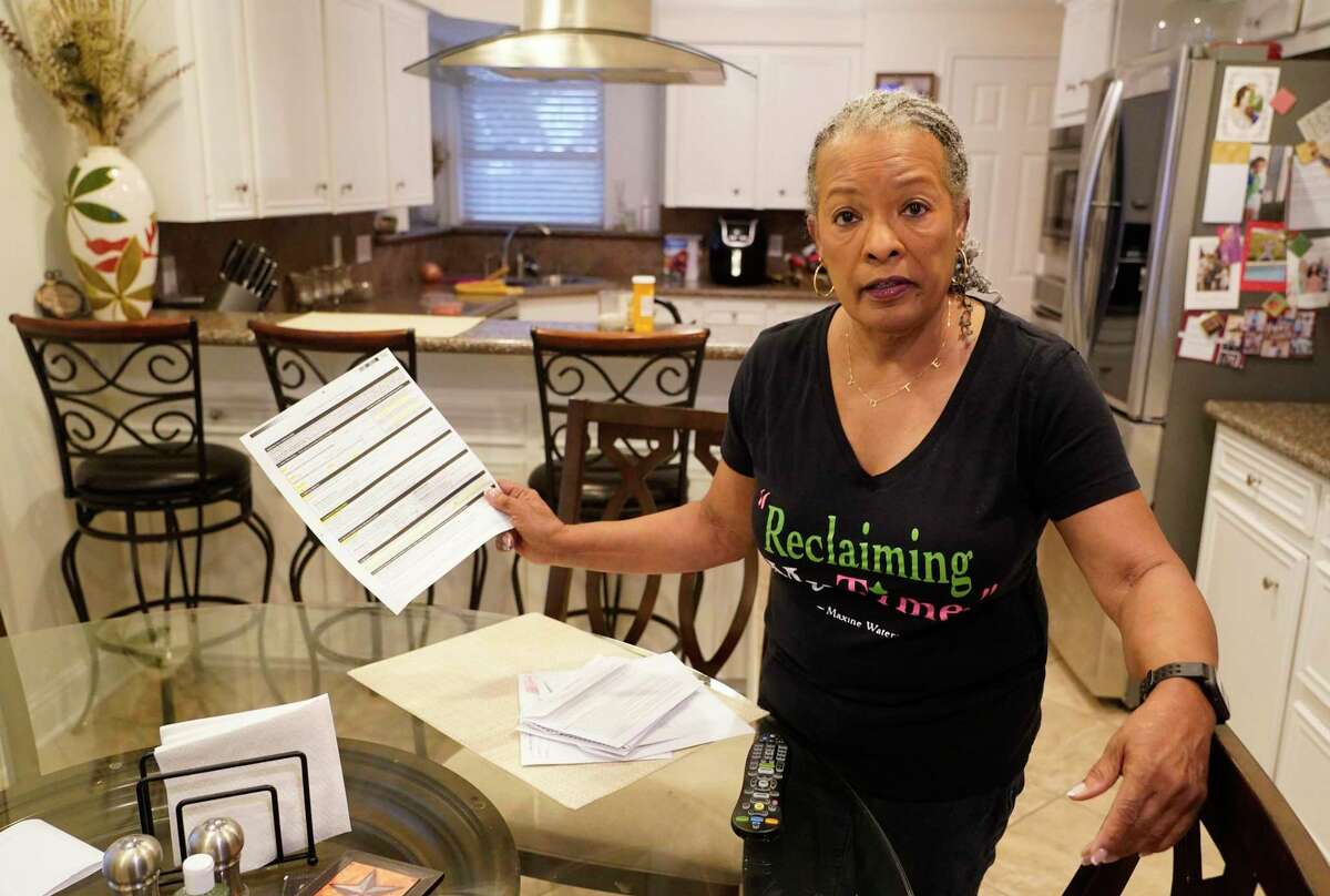 Pam Gaskin talks about the request form for a mail ballot at her home Monday, Jan. 31, 2022 in Missouri City. She advises people to fill out all the blanks. She finally received her mail ballot today after multiple requests were rejected earlier this year.