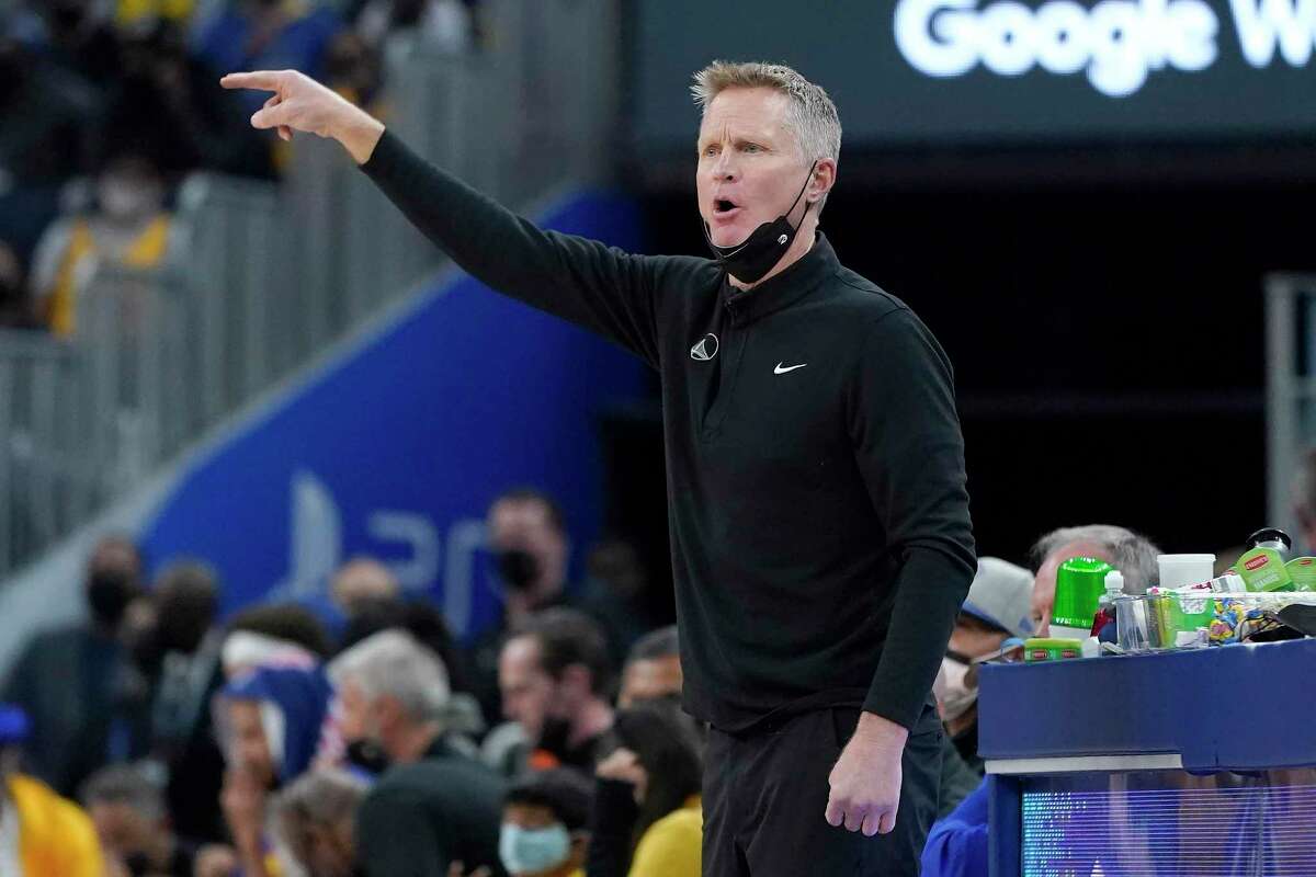 Golden State Warriors head coach Steve Kerr gestures toward players during the first half of his team's NBA basketball game against the Brooklyn Nets in San Francisco, Saturday, Jan. 29, 2022. (AP Photo/Jeff Chiu)