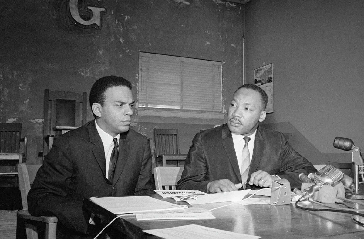 Dr. Martin Luther King and Andrew Young at a news conference in November, 1964.