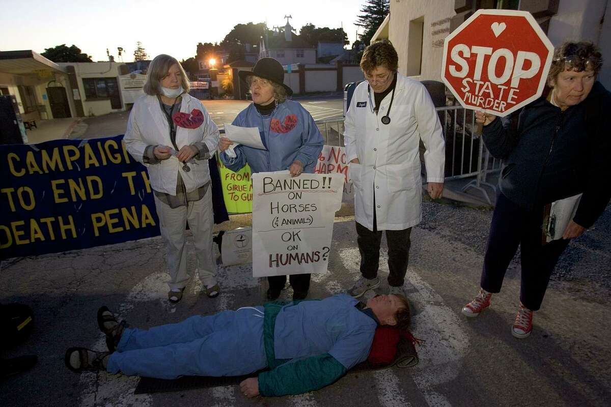 Death penalty protesters outside of San Quentin Prison where Michael Morales’ execution was delayed indefinitely Feb. 21, 2006. Morales won a reprieve when the state decided it could not comply with a federal judge's order to revise its execution procedures.