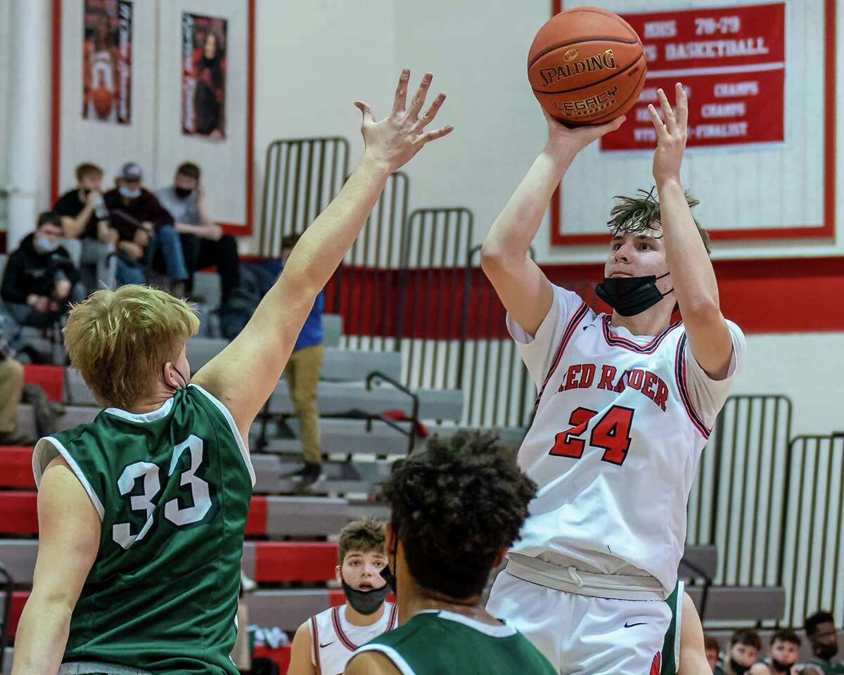 Mechanicville sophomore Colin Richardson takes a jumper over the outstretched arm of Greenwich senior Gavin Blair during a Wasaren League matchup at Mechanicville High School on Monday, Jan. 31, 2022. (Jim Franco/Special to the Times Union)