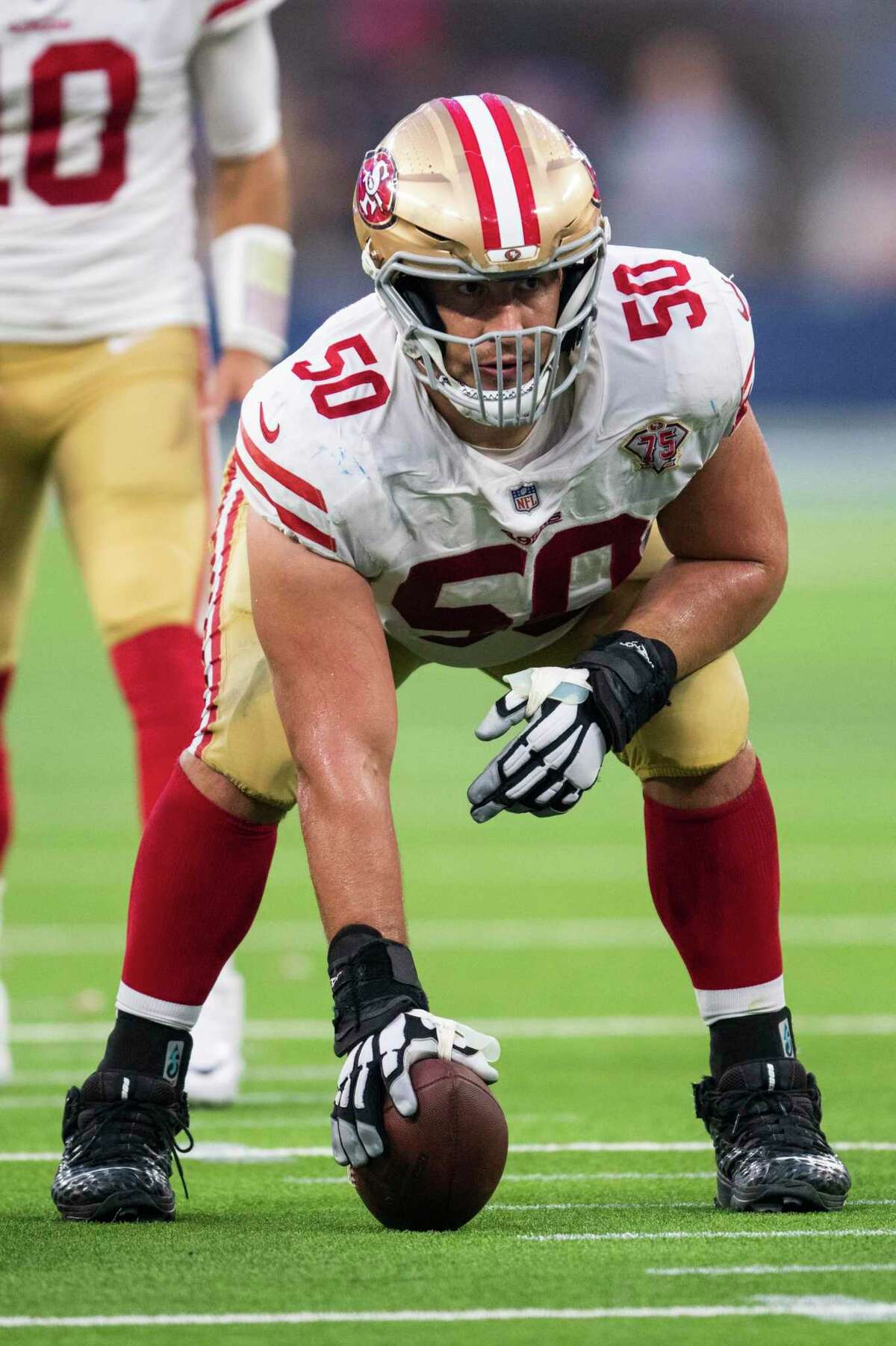 San Francisco 49ers center Alex Mack (50) gets ready to snap the ball during an NFL football game against the Los Angeles Rams Sunday, Jan. 9, 2022, in Inglewood, Calif. (AP Photo/Kyusung Gong)
