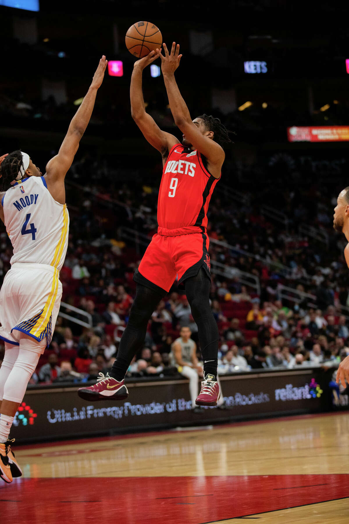 Houston Rockets guard Josh Christopher (9) scores against Golden State Warriors guard Moses Moody (4) during the first half of the game at the Toyota Center, Monday, Jan. 31, 2022, in Houston.