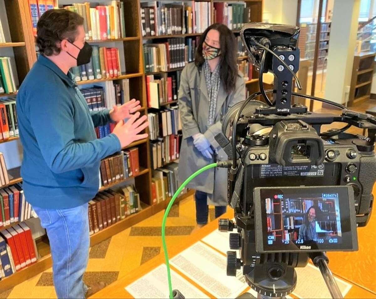 Filming of "My Haunted History" last week at City Hall in Granite City, with independent filmmaker and actor Colton Crawford, of Granite City, in background. 