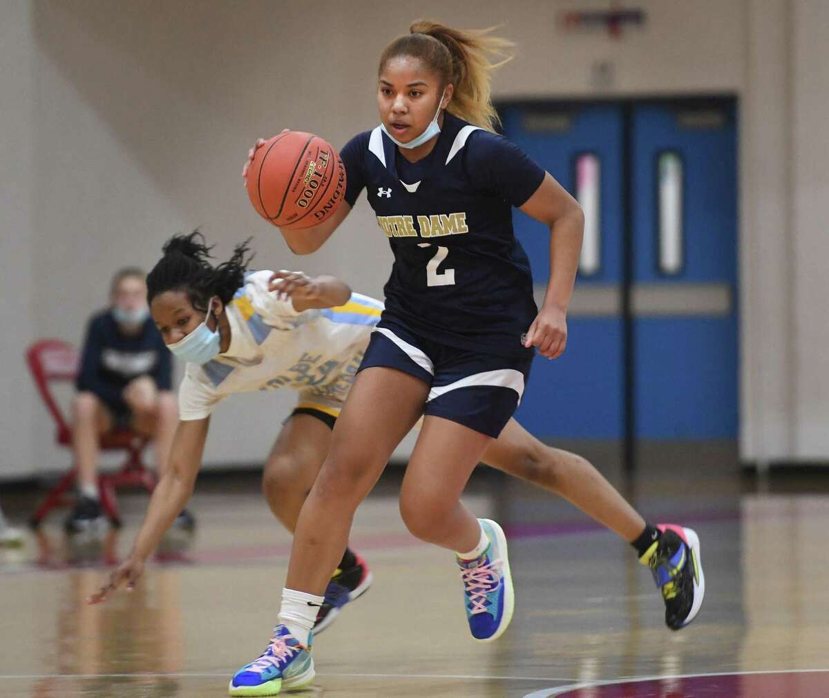 Notre Dame of Fairfield's Aizhanique Mayo races the ball up court during her team's girls basketball victory over Kolbe Cathedral at the Sheehan Center in Bridgeport, Conn. on Friday, January 28, 2022.