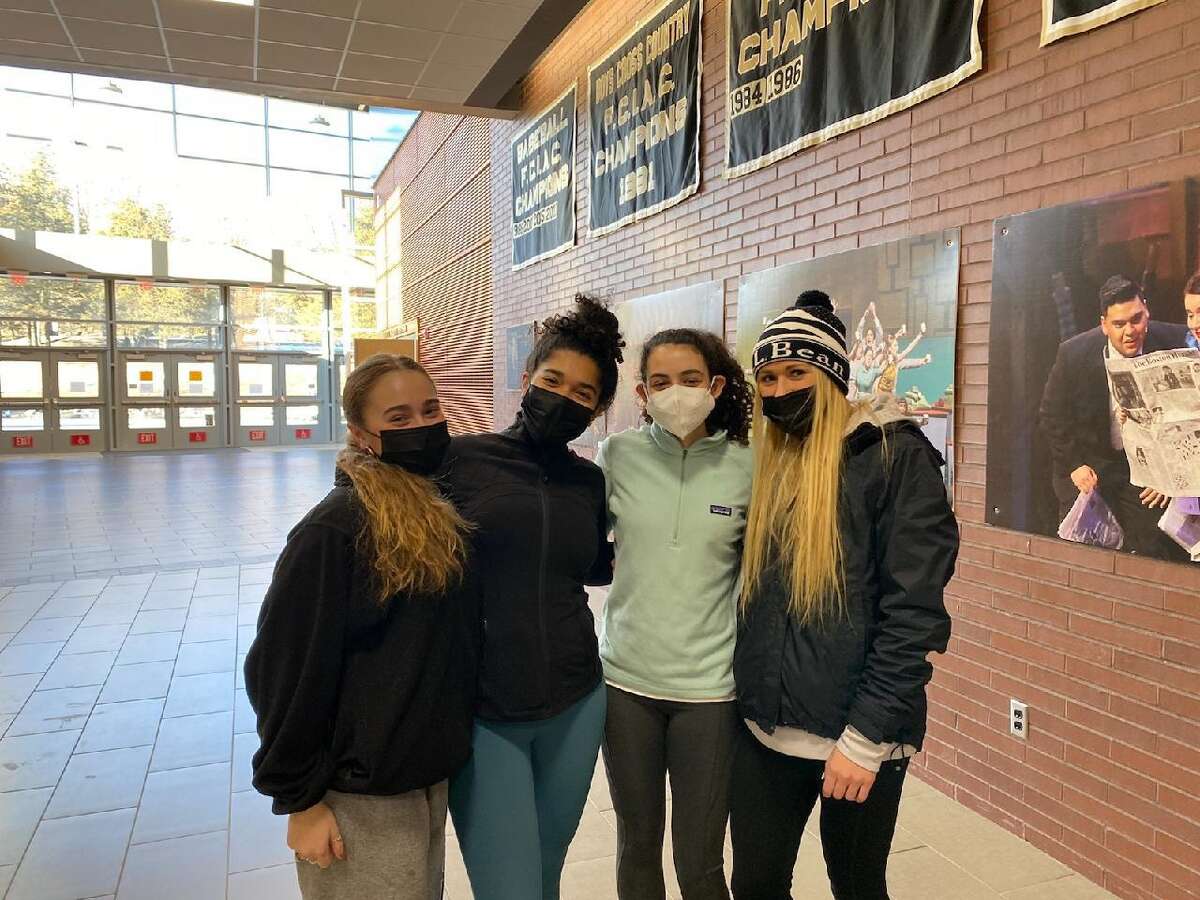 Lucy Ferreira, Olivia McCrea, Evelyn Marchand and Kali Holden are team captains for Trumbull's girls indoor track team.